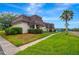 Condo building with palm tree and street view at 7020 Cognac Dr # 3, New Port Richey, FL 34653