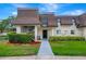 Attractive condo building with landscaping and walkway at 7020 Cognac Dr # 3, New Port Richey, FL 34653