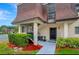 Condo entrance with stairs and well-maintained landscaping at 7020 Cognac Dr # 3, New Port Richey, FL 34653