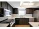 Modern kitchen with stainless steel appliances and updated cabinetry at 7020 Cognac Dr # 3, New Port Richey, FL 34653