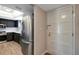 Modern kitchen with stainless steel appliances and dark cabinets at 7020 Cognac Dr # 3, New Port Richey, FL 34653