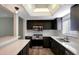 Updated kitchen with stainless steel appliances and an island at 7020 Cognac Dr # 3, New Port Richey, FL 34653