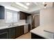 Modern kitchen with stainless steel appliances and white countertops at 7020 Cognac Dr # 3, New Port Richey, FL 34653