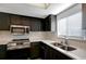 Updated kitchen featuring stainless steel appliances and dark wood cabinets at 7020 Cognac Dr # 3, New Port Richey, FL 34653