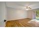 Living room with wood-look floors and sliding glass doors at 7020 Cognac Dr # 3, New Port Richey, FL 34653