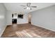 Living room with kitchen pass-through and wood-look floors at 7020 Cognac Dr # 3, New Port Richey, FL 34653