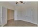 Bright bedroom with neutral carpeting and double doors to a closet at 7510 S Sparkman St, Tampa, FL 33616