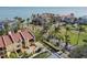 Aerial view of luxurious waterfront homes, palms, and manicured lawns at 7550 Sunshine Skyway S Ln # T48, St Petersburg, FL 33711