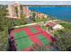 Aerial view of condo buildings, tennis courts and waterfront at 7550 Sunshine Skyway S Ln # T48, St Petersburg, FL 33711