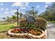 Community entrance with Seapointe sign, landscaping and path at 7550 Sunshine Skyway S Ln # T48, St Petersburg, FL 33711
