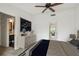 Comfortable main bedroom with stylish decor, leading to the bathroom, and a balcony view at 7550 Sunshine Skyway S Ln # T48, St Petersburg, FL 33711