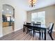 Dining room with view into the kitchen and backyard at 8810 Sandy Plains Dr, Riverview, FL 33578