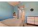 Bedroom with double bed, dresser, and access to bathroom at 10280 Post Harvest Dr, Riverview, FL 33578
