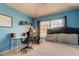 Bright bedroom with built-in workspace and large window at 10280 Post Harvest Dr, Riverview, FL 33578
