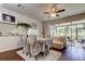 Bright dining area with hardwood floors and access to a screened porch at 10280 Post Harvest Dr, Riverview, FL 33578