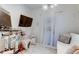 Bright guest room with a comfy sofa and access to outdoor space at 10280 Post Harvest Dr, Riverview, FL 33578