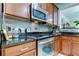 Stainless steel appliances and granite countertops in a well-lit kitchen at 10280 Post Harvest Dr, Riverview, FL 33578