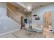 Open living area with white couch and a unique chandelier at 10280 Post Harvest Dr, Riverview, FL 33578