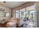 Living room with comfy sofa and view of the screened porch at 10280 Post Harvest Dr, Riverview, FL 33578