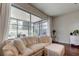 Relaxing living room with a sofa and screened patio access at 10280 Post Harvest Dr, Riverview, FL 33578