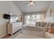 Spacious main bedroom with large windows and cozy sitting area at 10280 Post Harvest Dr, Riverview, FL 33578