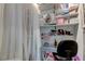 Small home office with desk and built-in shelving at 10280 Post Harvest Dr, Riverview, FL 33578