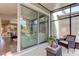 Screened porch with sliding doors leading to living area at 10280 Post Harvest Dr, Riverview, FL 33578