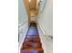 Elegant wooden staircase with white railings at 10280 Post Harvest Dr, Riverview, FL 33578