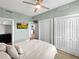 Spacious bedroom with ample closet space and a TV at 1208 E Kennedy Blvd # 923, Tampa, FL 33602