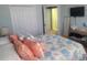 Bedroom with coastal decor and access to a laundry room at 2309 Tanbark Ridge Pl, Plant City, FL 33563