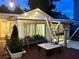 Evening view of backyard deck with string lights at 2666 44Th S St, Gulfport, FL 33711
