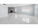 Living room with fireplace, marble floors, and lots of natural light at 4000 14Th Ne Way, St Petersburg, FL 33703