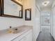 Bathroom with single sink vanity and access to bedroom at 5506 79Th E Ave, Palmetto, FL 34221