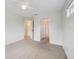 Spacious bedroom with carpeting and access to bathroom and hallway at 5506 79Th E Ave, Palmetto, FL 34221