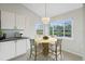 Kitchen dining area with a round wooden table and a view of the canal at 5506 79Th E Ave, Palmetto, FL 34221