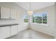 Bright dining area with a table for four and a view of the water at 5506 79Th E Ave, Palmetto, FL 34221
