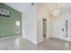 Spacious entryway with light tile floors and a view into the living room at 5506 79Th E Ave, Palmetto, FL 34221