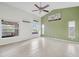 Large living room with vaulted ceilings, tile flooring, and ample natural light at 5506 79Th E Ave, Palmetto, FL 34221