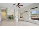 Open living room and kitchen with tile floors and lots of natural light at 5506 79Th E Ave, Palmetto, FL 34221