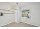 Room with built-in shelving, window, and tile flooring at 5506 79Th E Ave, Palmetto, FL 34221