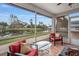 Relaxing screened patio overlooking a tranquil canal, perfect for enjoying Florida living at 5506 79Th E Ave, Palmetto, FL 34221