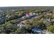 An aerial shot showcasing a building's setting among surrounding homes at 5727 Desert Rose Pl, Tampa, FL 33615