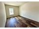 Cozy bedroom with hardwood flooring and a window at 5727 Desert Rose Pl, Tampa, FL 33615