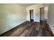 Bedroom featuring hardwood flooring and neutral walls at 5727 Desert Rose Pl, Tampa, FL 33615