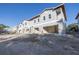 Modern townhome under construction, featuring attached garages at 5727 Desert Rose Pl, Tampa, FL 33615