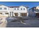 Newly constructed townhome with attached garage and modern facade at 5727 Desert Rose Pl, Tampa, FL 33615