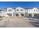 Brand new three-unit townhome building with attached garages at 5727 Desert Rose Pl, Tampa, FL 33615