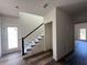 Hallway with staircase and hardwood flooring at 5727 Desert Rose Pl, Tampa, FL 33615