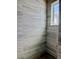 Modern shower with grey tiled walls and floors. A window is located on the back wall at 5727 Desert Rose Pl, Tampa, FL 33615