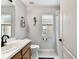 Bathroom with shower, toilet and modern decor at 6410 Chapel Pines Blvd, Wesley Chapel, FL 33545